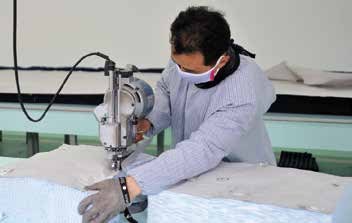 Worker operating automatic cutting machine