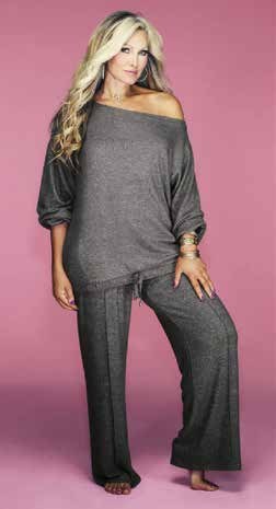 Model wearing a grey co-ord set on a pink background